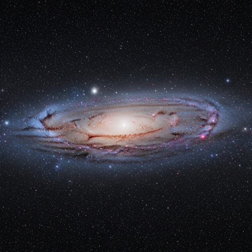 The Milky Way spiral galaxy, 100,000 light-years across, with billions of stars orbiting a central supermassive black hole